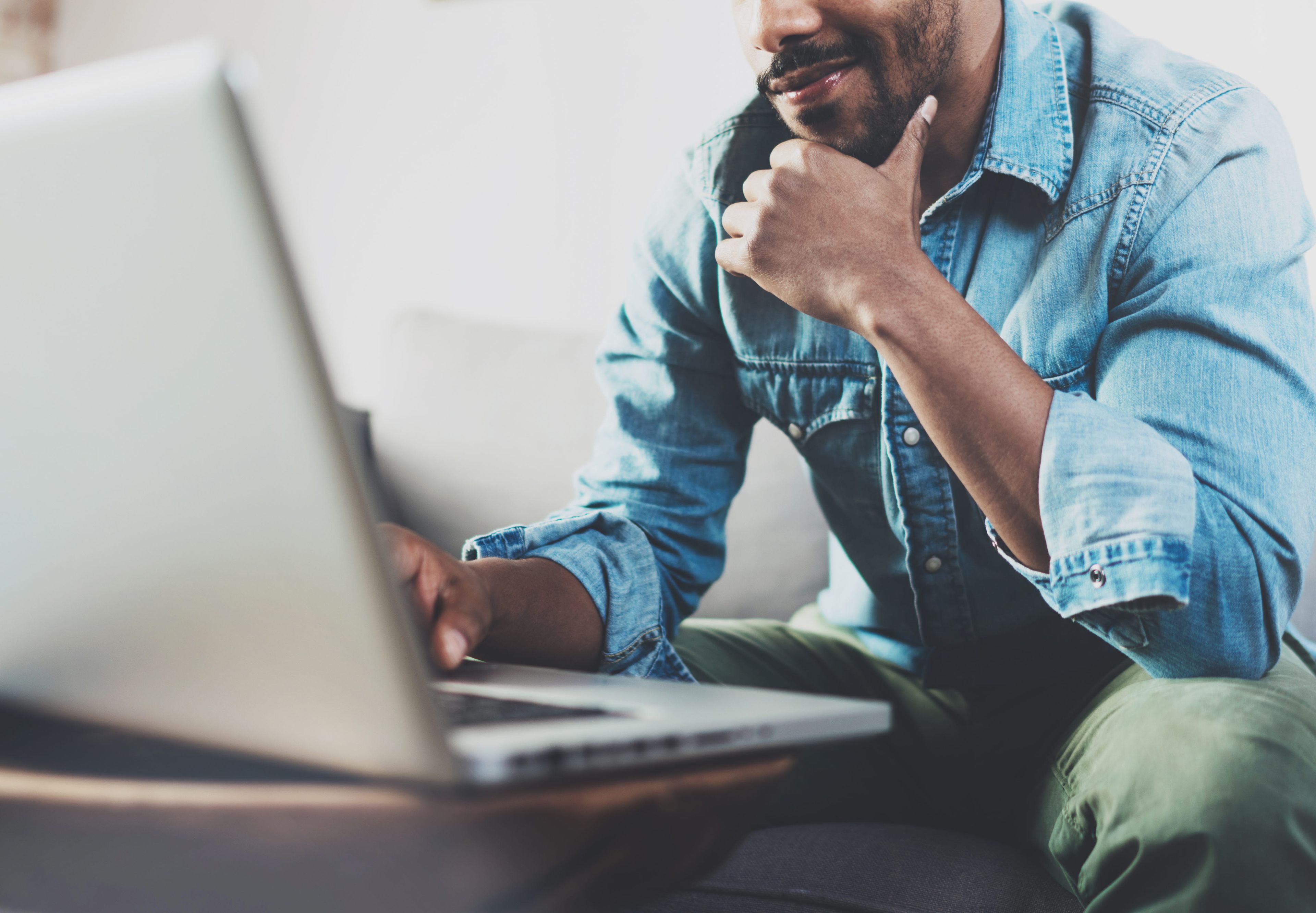 man in front of a laptop