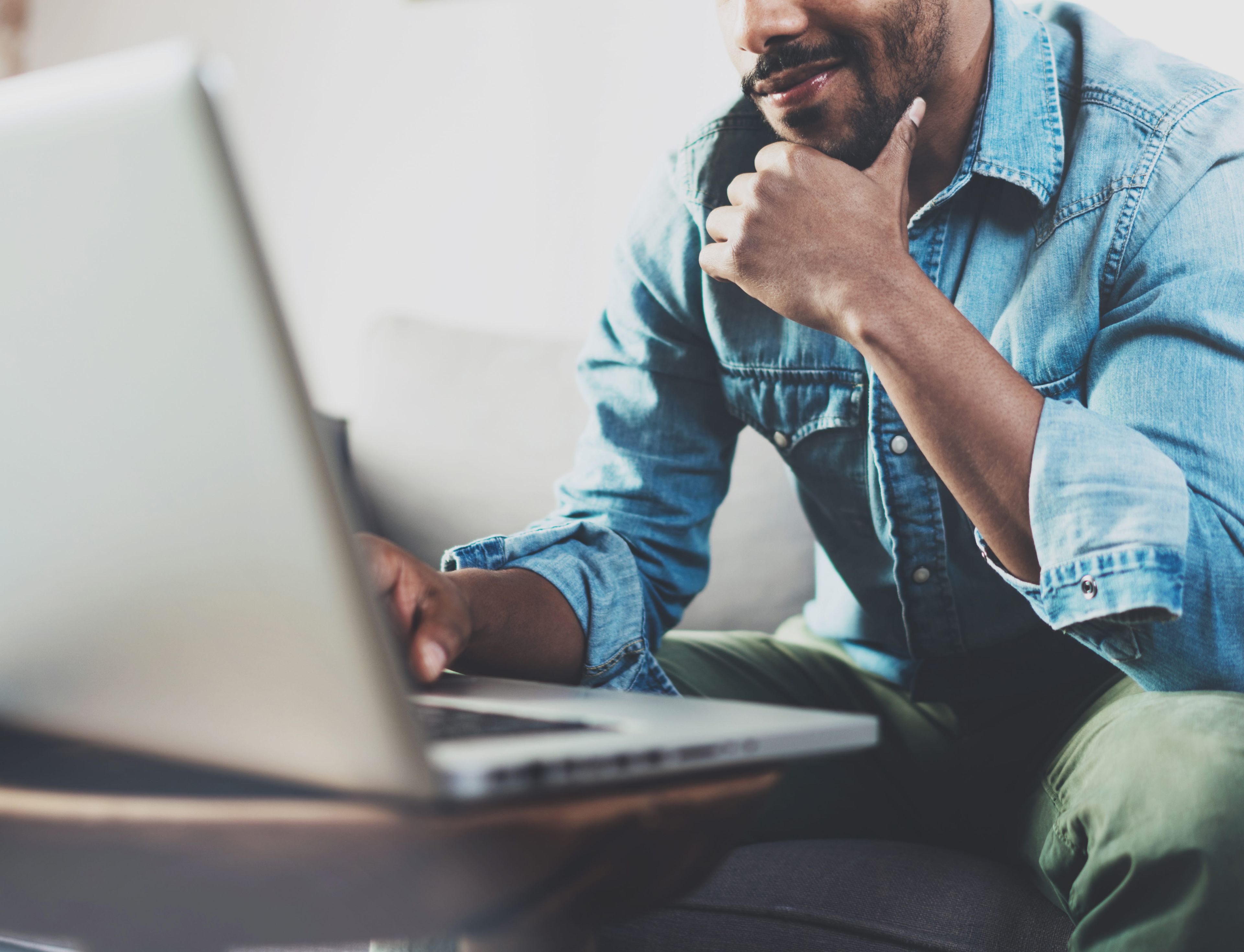 man in front of a laptop