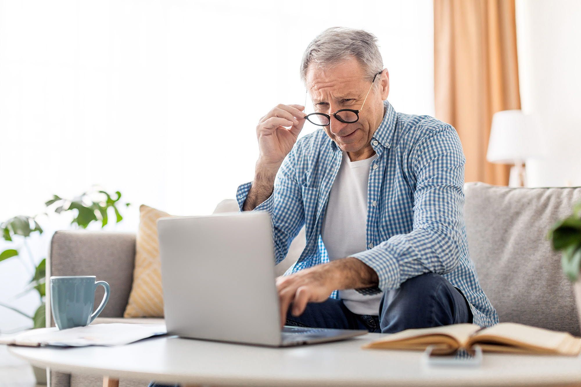 Older man at a laptop