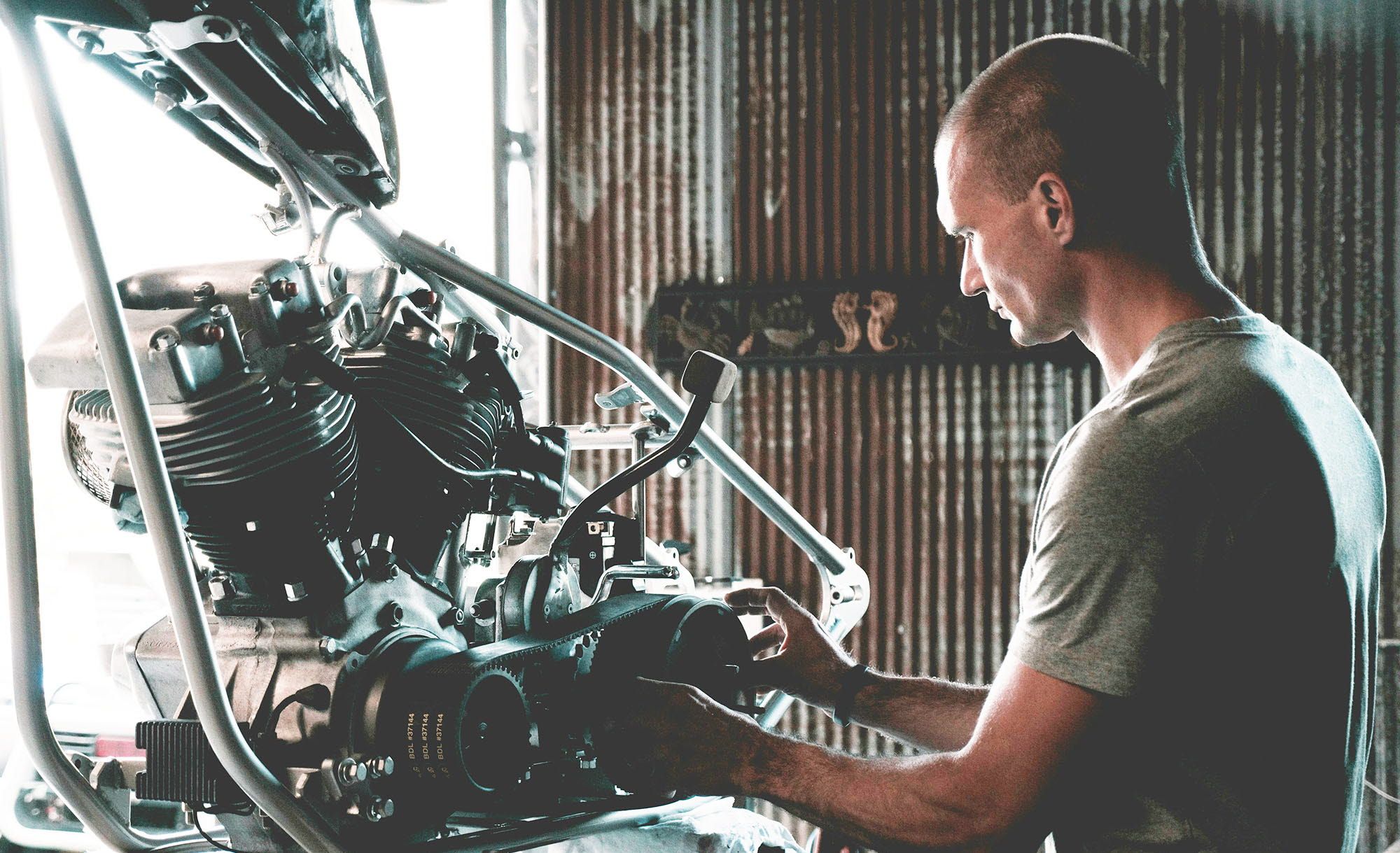 A mechanic working on an engine